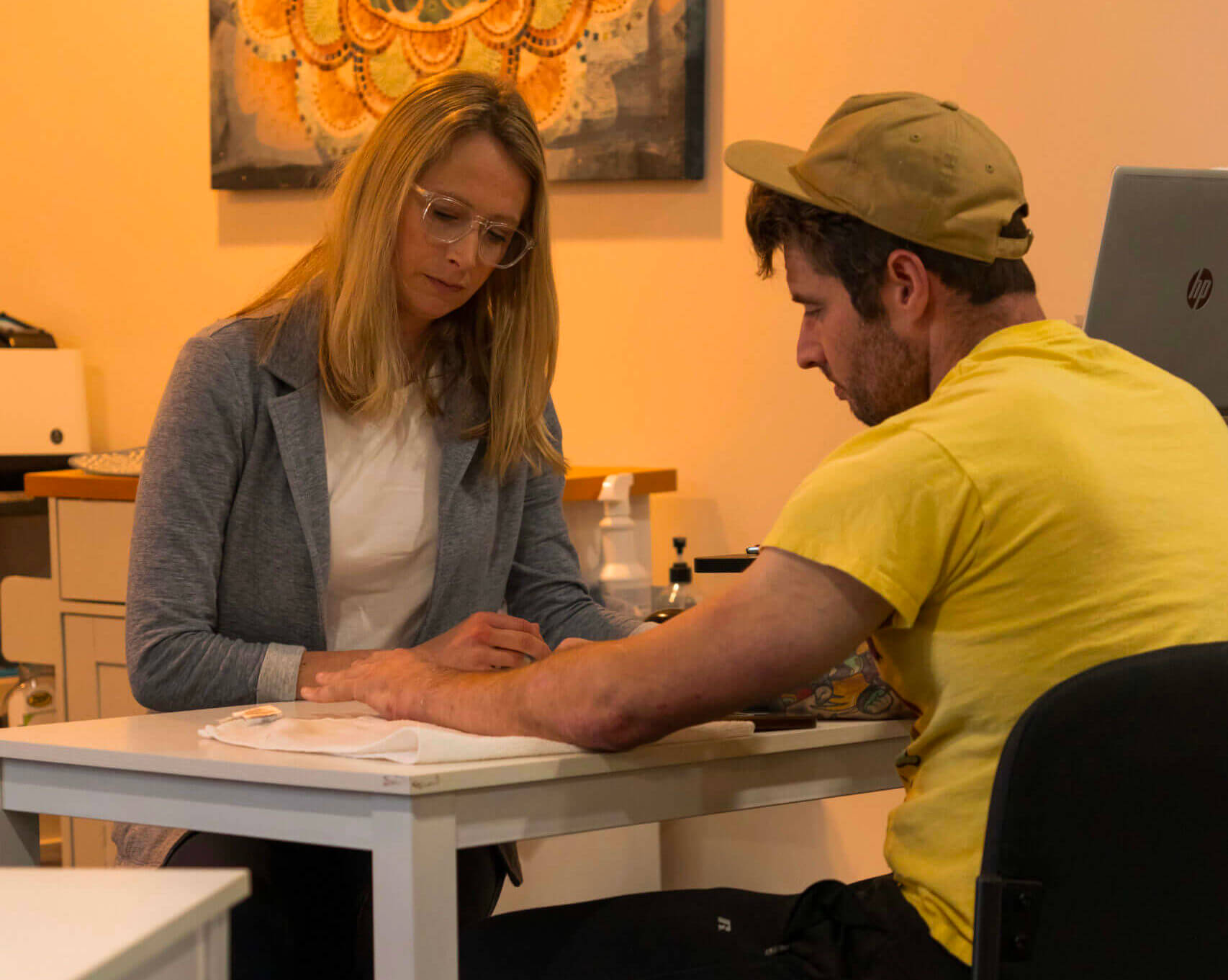 hand therapist working with patient