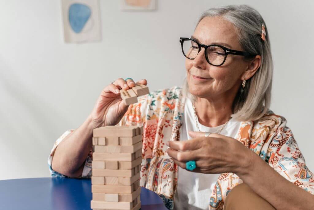 senior with dementia doing a puzzle game