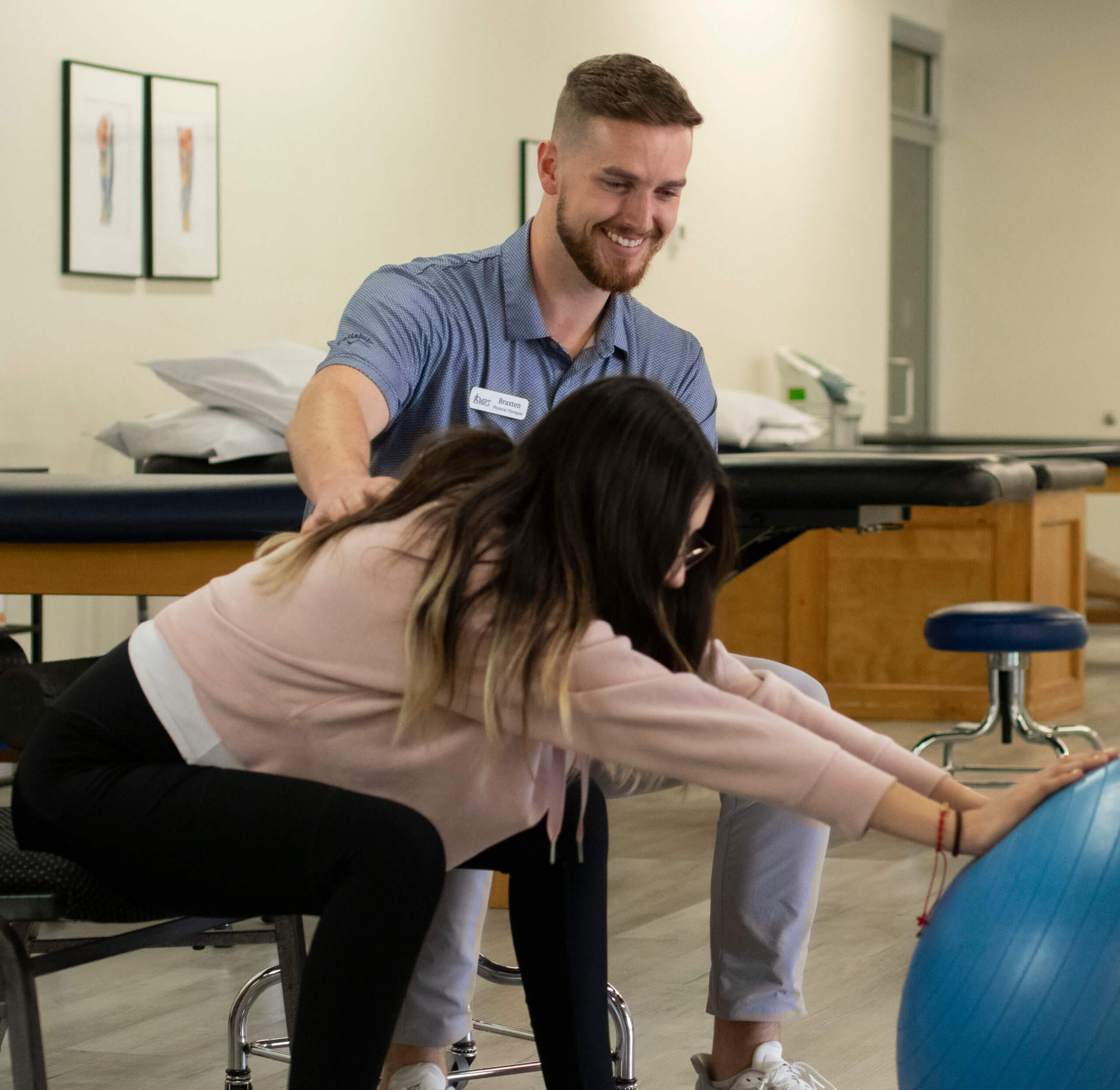 physical therapist working with patient on balance