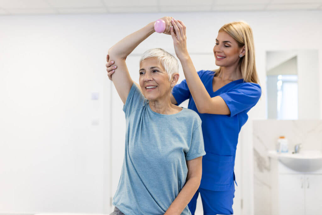 physical therapy for treatment for arm and shoulder of senior female patient